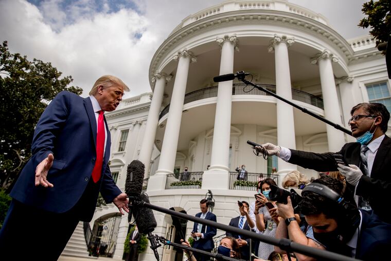 President Donald Trump speaks with members of the media before boarding Marine One on the South Lawn of the White House in Washington, Thursday, Aug. 6, 2020.