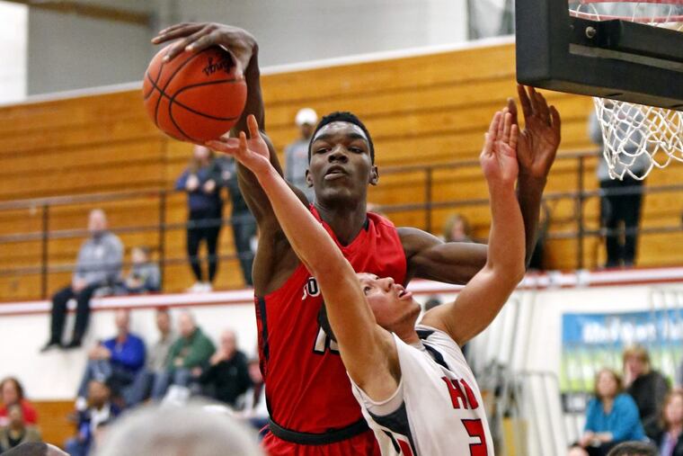Plymouth Whitemarsh 7-foot junior center Naheem McLeod, left, is being recruited by a number of top-flight Division I colleges.
