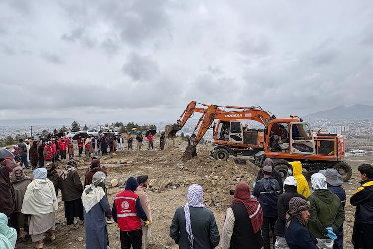 Bulldozers dig graves for victims of a Monday airstrike on a drug rehabilitation hospital in Kabul, Afghanistan, Wednesday, March 18, 2026. (AP Photo/Siddiqullah Alizai)