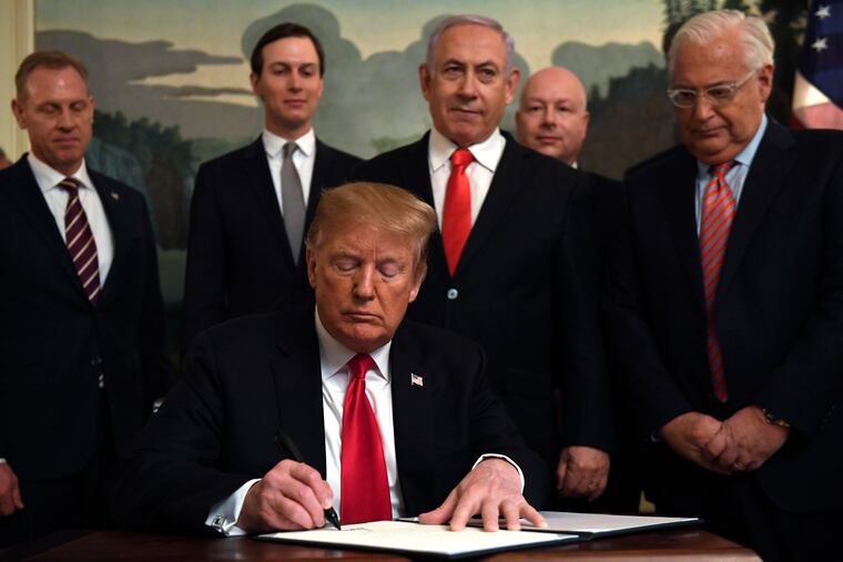 President Donald Trump (front) signs a proclamation formally recognizing Israel's sovereignty over the Golan Heightsin 2019. Others attending were (from left) acting Defense Secretary Patrick Shanahan, White House adviser Jared Kushner, Israeli Prime Minister Benjamin Netanyahu, U.S. special envoy Jason Greenblatt, and U.S. Ambassador to Israel David Friedman.