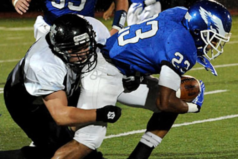Paul VI's Johnel Anderson, right, scored the game's only touchdown on a 70-yard run. (April Saul/Staff Photographer)