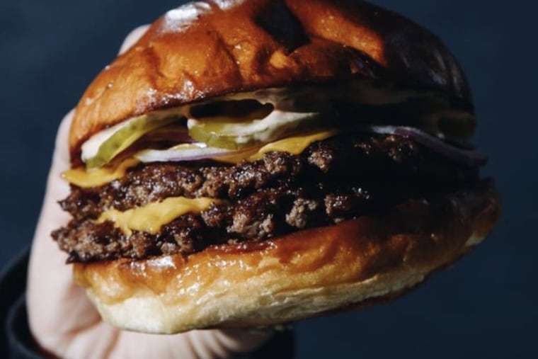 A double smash burger from the Burger That Ate Philadelphia, a ghost kitchen by Starr Restaurant Organization.