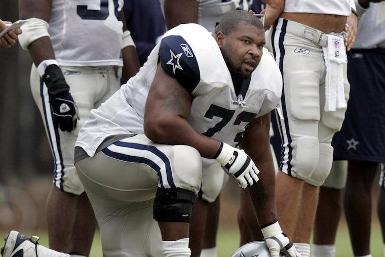 Dallas Cowboys lineman Larry Allen taking a knee during training camp on Aug. 1, 2005, in Oxnard, Calif.