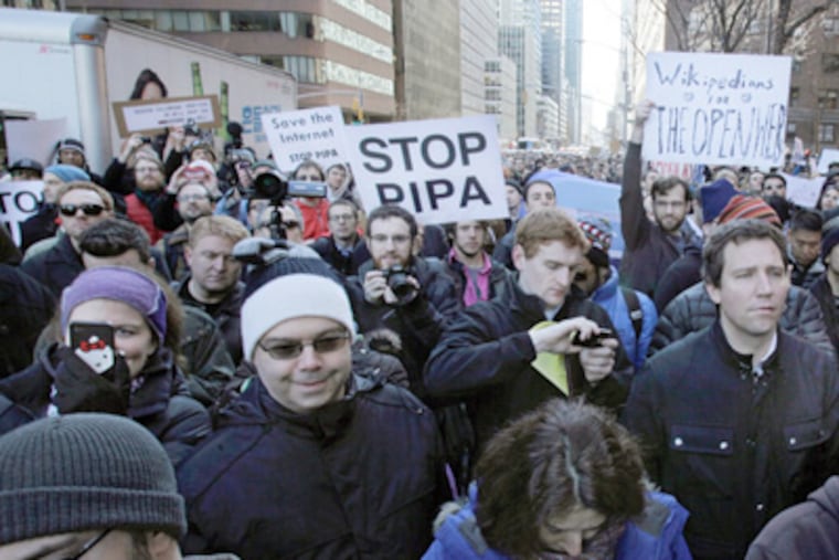 Demonstrators gathered Wednesday outside the offices of Sens. Charles E. Schumer and Kirsten Gilliband in New York. (Richard Drew / Associated Press)