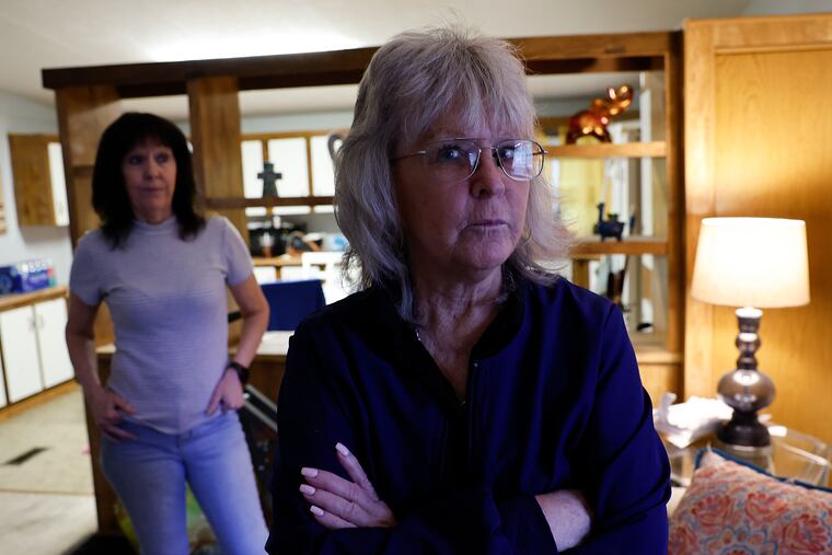 Anne Bortner (right) with sister Karen Schiendelman at Schiendelman’s Sicklerville, N.J. home, May 10, 2024. They invested an inheritance with accountant Joe Pezzano and now are among dozens trying to locate millions of dollars after Pezzano’s death.