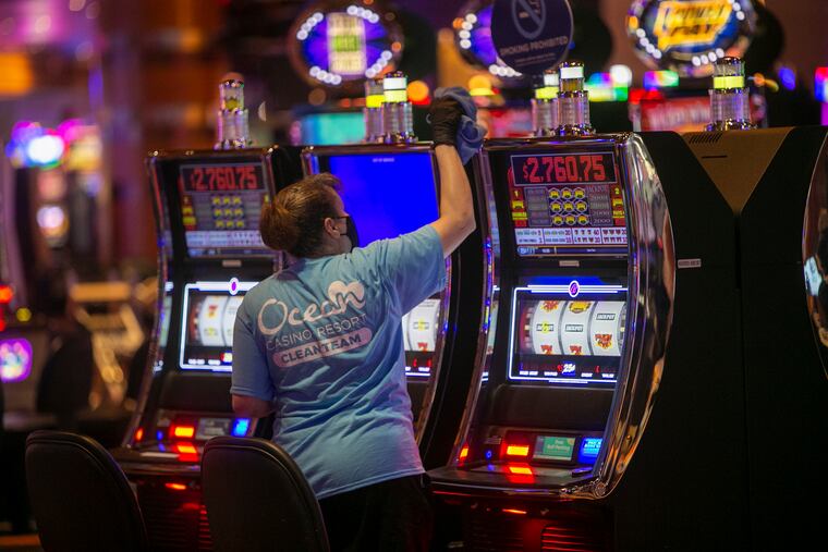 A member of the Ocean Casino Resort, Clean Team wipes down slot machines. Atlantic City is preparing to reopening its casinos during mandatory shutdown during Covid-19 pandemic. The casino resort will open July 2, at 25% capacity.