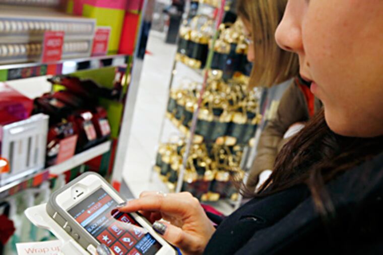 Shopping by app while at Macy’s in Boston. With Price Check by Amazon, scan a bar code or say the product name to compare prices - even buy from an online vendor while still in the store. MICHAEL DWYER / Associated Press