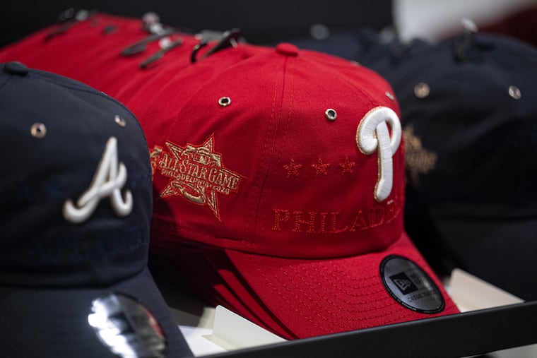 Commemorative baseball caps on display at All-Star Village inside the Convention Center.