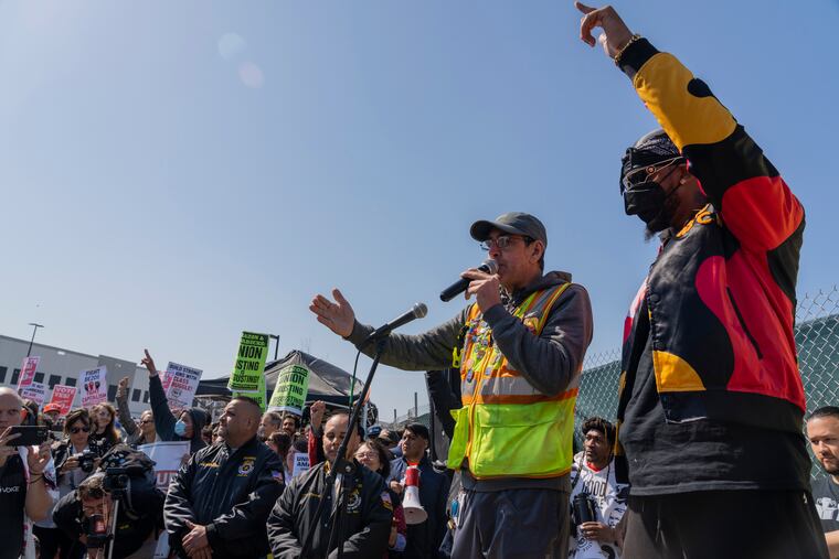 Pat Cioffi (left) and Chris Smalls at a rally in front of the Amazon LDJ5 warehouse on April 24. Workers at the warehouse voted last week on a proposal to unionize.