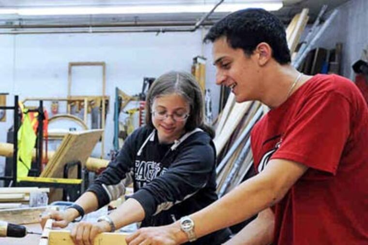 Building sets at the Summer Stage program in Blackwood are Dana Melnyk, 17, and Kevin Gorenberg, 16. (Sharon Gekoski-Kimmel / Staff Photographer)
