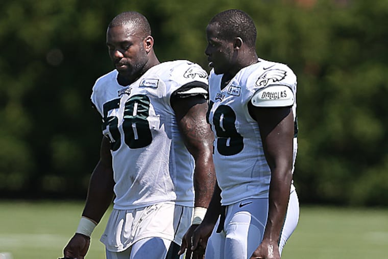 The Eagles' Trent Cole and Josh Kaddu. (David Maialetti/Staff Photographer)