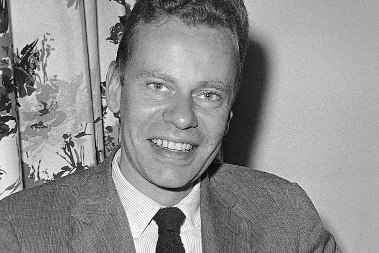 FILE - This Oct. 14, 1959 file photo shows Charles Van Doren at New York's Hotel Roosevelt. Van Doren, who admitted his television quiz show performances in the 1950s had been rigged, died on Tuesday, April 9, 2019, in Canaan, Conn. He was 93. (AP Photo)