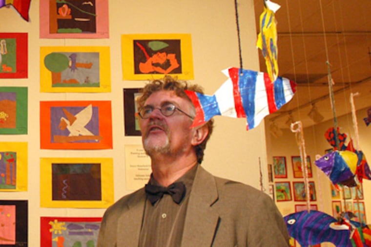 Warren Angle, Exhibitions Curator; stand in the Annual Young People's Exhibition, Artwork by Saturday Program Students, at the Fleisher Art Memorial. (File photo)