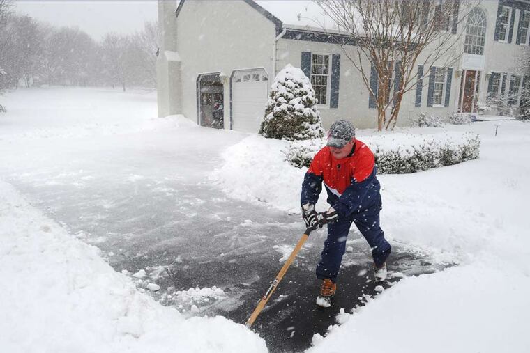 Rich Maley has a hard time keeping up with the falling snow as he shovels his driveway in Thornton, PA March 5, 2015. About five inches of snow had fallen by 10:30 am with as much as eight inches forecast. ( CLEM MURRAY / Staff Photographer )