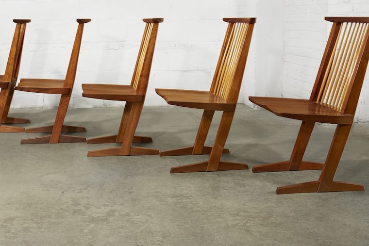 A set of six Conoid dining chairs, made of American black walnut and hickory by George Nakashima. The chairs, part of the Ottenberg collection, will be auctioned Monday at Freeman's auction house in Philadelphia.