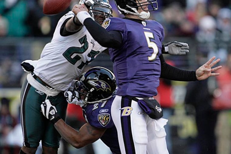 Then-rookie Ravens quarterback Joe Flacco's attempt at a pass is rudely interrupted by Quintin Mikell in a 2008 game against the Eagles.