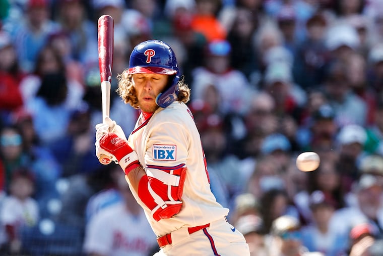 Phillies third baseman Alec Bohm gets hit by a pitch during the sixth inning against Texas at Citizens Bank Park.