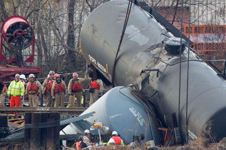 Work crews prepared to hoist derailed tanker cars from the Mantua Creek in Paulsboro on Dec. 12, 2012. (File photo: Ed Hille / Staff Photographer)