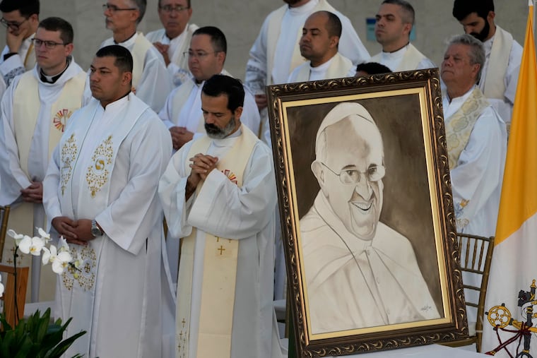 Religious leaders attend Mass Monday in honor of Pope Francis, following the Vatican's announcement of his death, at the Cathedral in Brasilia, Brazil.