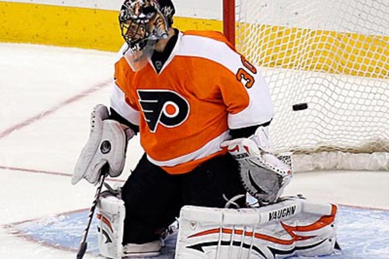 Despite his high salary, Ilya Bryzgalov has struggled to keep the puck out of the net. (Yong Kim/Staff file photo)