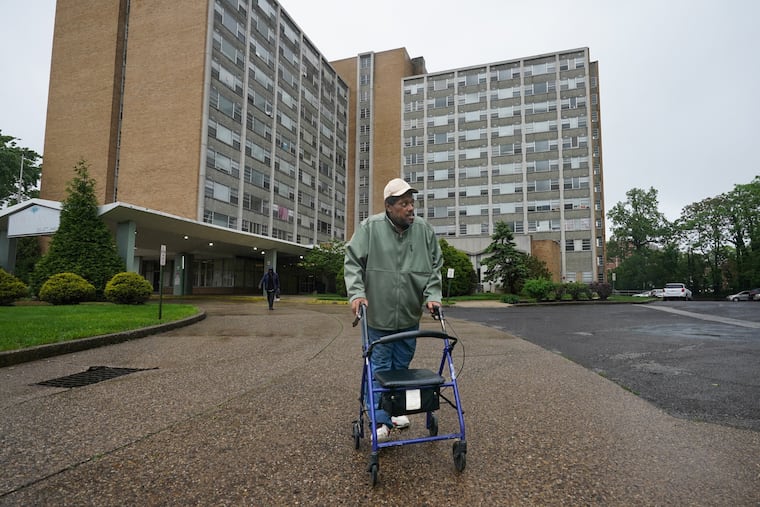 Timothy Sharpe outside Brith Sholom House, a large apartment building in Wynnefield where senior citizens reside. The building is in severe disrepair, and PHA today announced tenants would have to move out while it is fixed up.