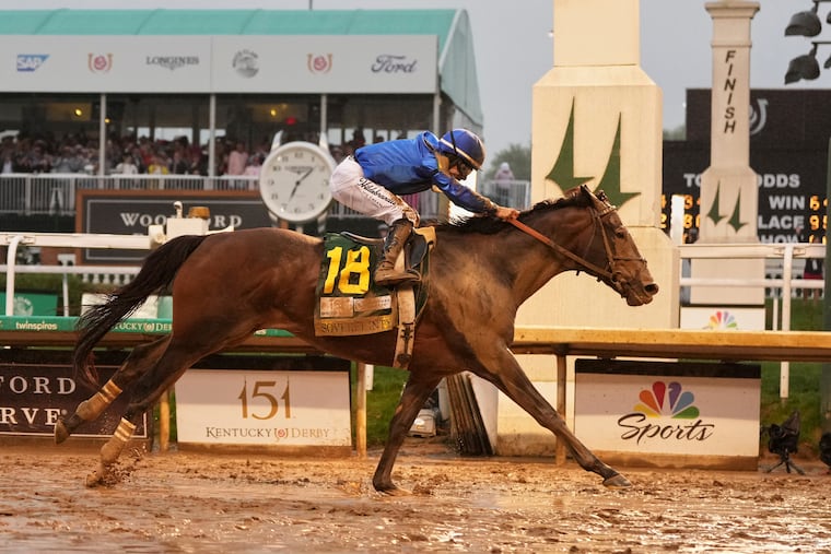 Sovereignty, ridden by Junior Alvarado, crosses the finish line to win the 151st running of the Kentucky Derby.