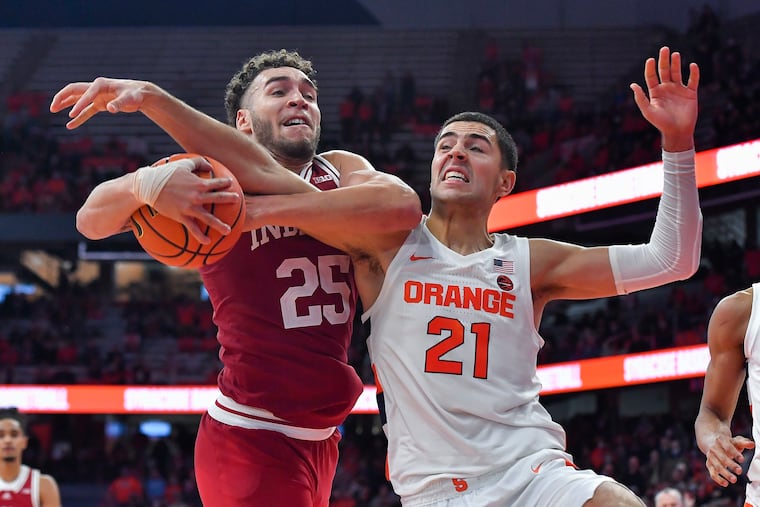Indiana forward Race Thompson (left) and Syracuse forward Cole Swider fight for a rebound on Nov. 30.