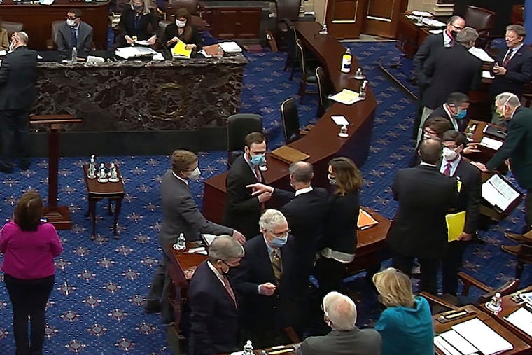 Senate Minority Leader Mitch McConnell (R.,Ky.), lower center-right, and other Republican senators and staff talk on the Senate floor after a vote Saturday on whether to allow witnesses in the second impeachment trial of former President Donald Trump. The Senate ultimately acquitted Trump on Saturday, a coda, at least for now, to his tumultuous four years in office.