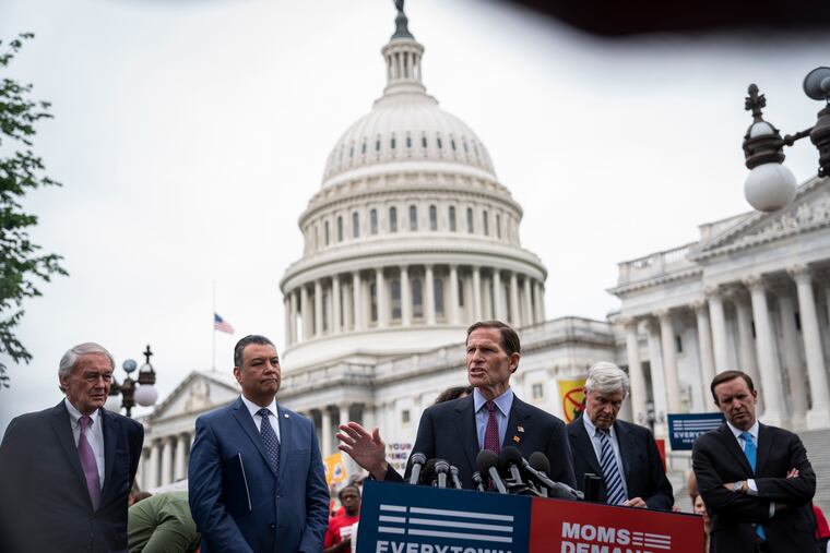 Sen. Richard Blumenthal, D-Conn. (middle), speaking during a news conference on Capitol Hill on May 26 demanding action on gun control legislation two days after a gunman killed 19 children and two teachers in a Texas elementary school.