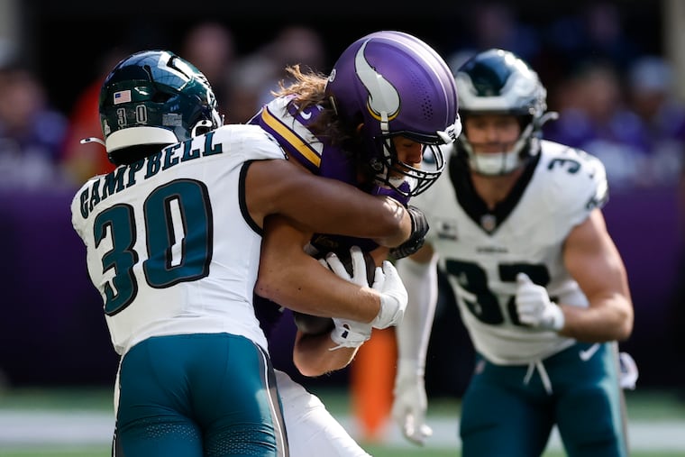 Eagles linebacker Jihaad Campbell stops Minnesota Vikings tight end T.J. Hockenson on Sunday, October 19, 2025 in Minneapolis.