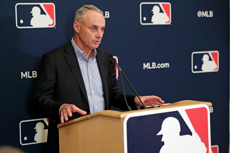 Commissioner Rob Manfred said he does not consider the Miami Marlins' COVID-19 outbreak a nightmare, but he's not in charge of rescheduling games.