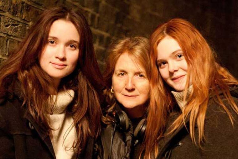 Alice Englert (ROSA), Sally Potter (DIRECTOR), and Elle Fanning (GINGER).