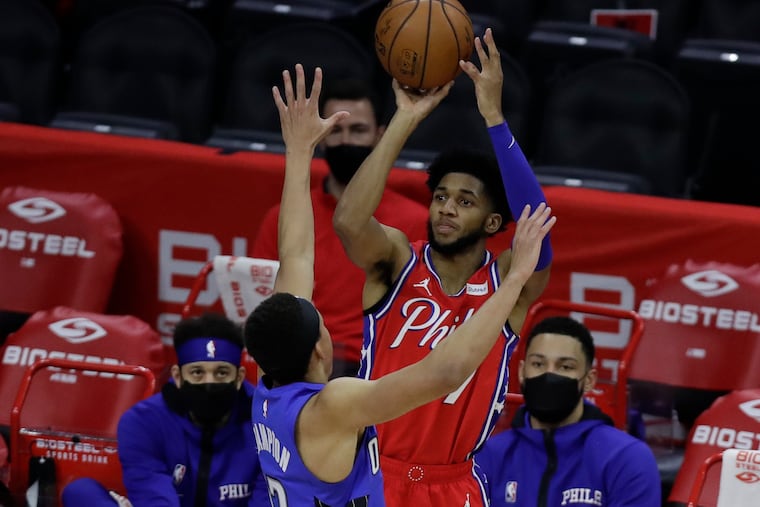 Sixers guard Isaiah Joe shoots the basketball against Orlando Magic guard R.J. Hampton last season.