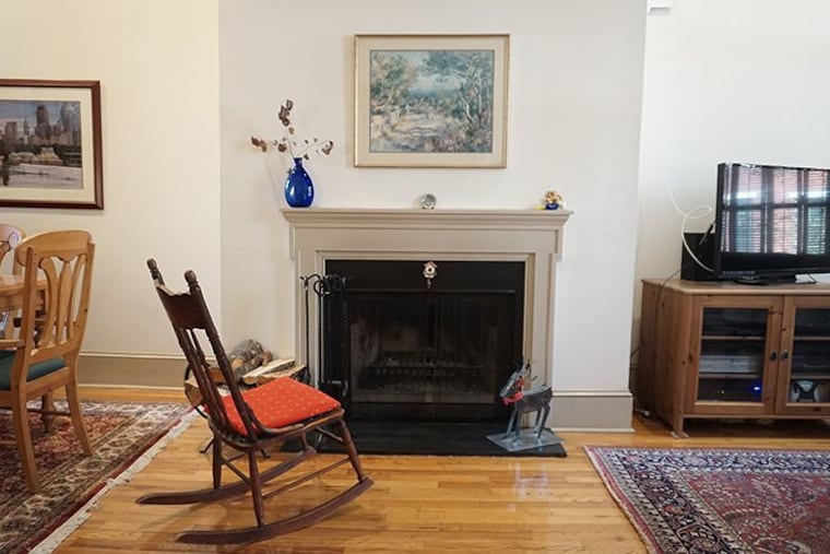The condo has a wood-burning fireplace between the dining and living room areas.