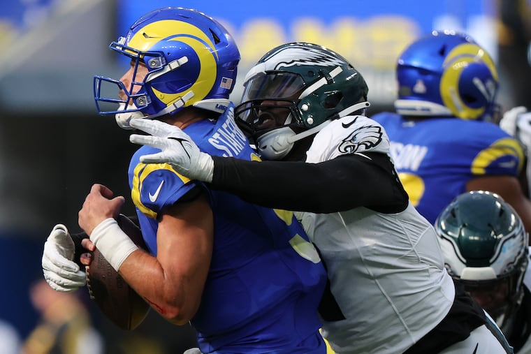 Eagles linebacker Haason Reddick sacks Los Angeles Rams quarterback Matthew Stafford late in the fourth quarter at SoFi Stadium in Inglewood, California on Sunday, Oct. 8, 2023.