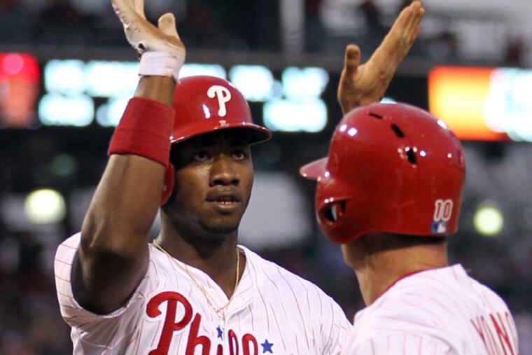 Domonic Brown and Michael Young celebrate. (Yong Kim/Staff Photographer)