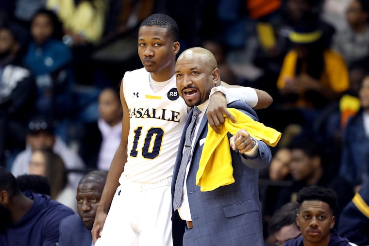 Former La Salle player Isiah Deas, left, and Explorers coach Ashley Howard.
