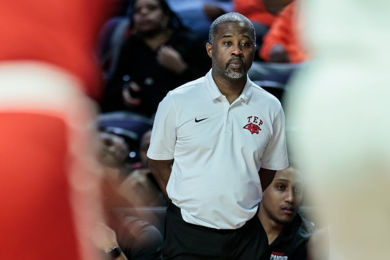 Imhotep Charter coach Andre Noble watching his team play Dobbins in the Public League semifinals on Feb. 21.