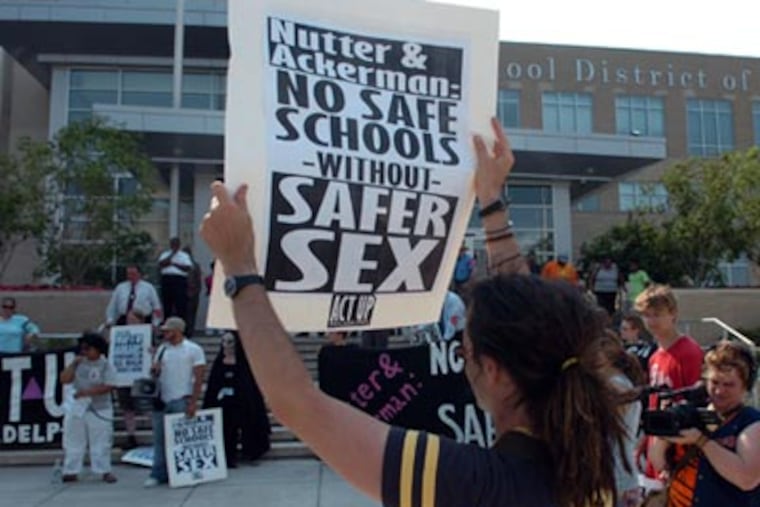 Safe-sex activists held a rally yesterday in front of the Phila. School District headquarters calling for free condom distribution in all area public high schools.
