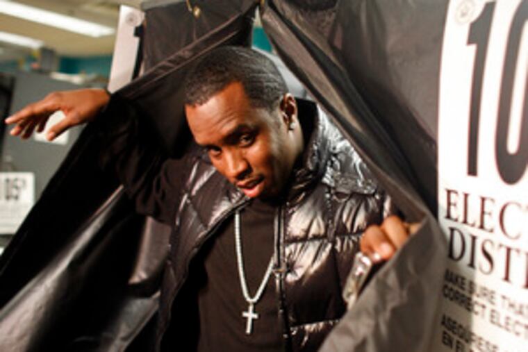 Sean "Diddy" Combs leaves voting booth at Coalition High School in New York City.