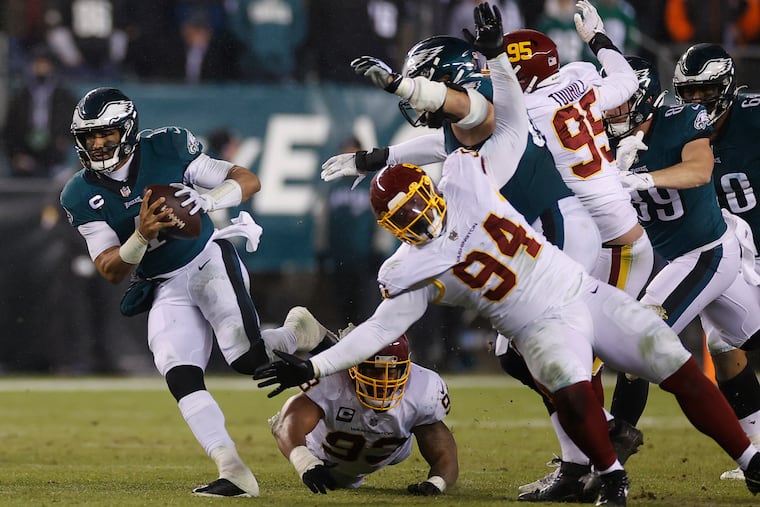 Philadelphia Eagles quarterback Jalen Hurts (1) running with the ball in the third quarter Tuesday, December 21, 2021 at Lincoln Financial Field in Philadelphia, Pa.