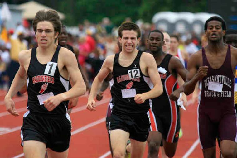 Haddonfield's Ben Potts (left) and Colin Baker finish first and third, respectively, in theboys' 800 meters. The Bulldogs successfully defended their team title in Group 2.