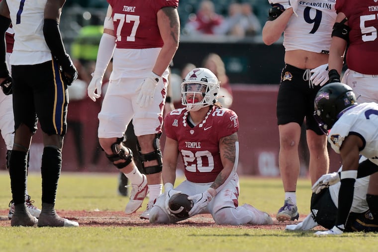 Temple’s runningback Jay Ducker gets up slowly after a broken play during Saturday's loss to East Carolina at Lincoln Financial Field. Ducker scored one of just two touchdowns for the Owls.