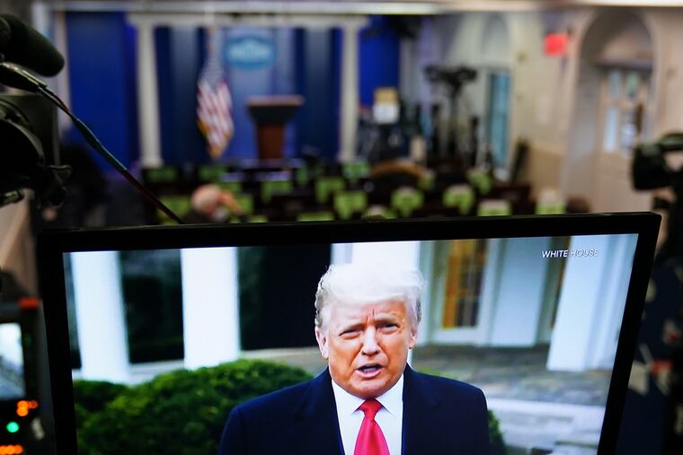U.S. President Donald Trump is seen on TV from a video message released on Twitter addressing rioters at the U.S. Capitol, in the Brady Briefing Room at the White House in Washington, D.C. on Wednesday, Jan. 6, 2020. Trump told his supporters on Wednesday to "go home" after they stormed the U.S. Capitol following a rally during which he repeated his spurious claims of election fraud.