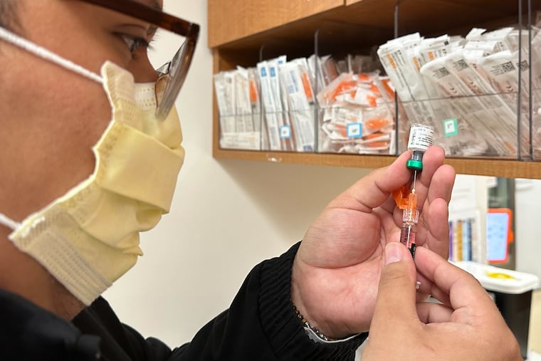 Licensed practical nurse Marco Flores prepares a patient's measles, mumps and rubella vaccine at Children's Minnesota on Nov. 20, 2025, in Minneapolis. (AP Photo/Devi Shastri)
