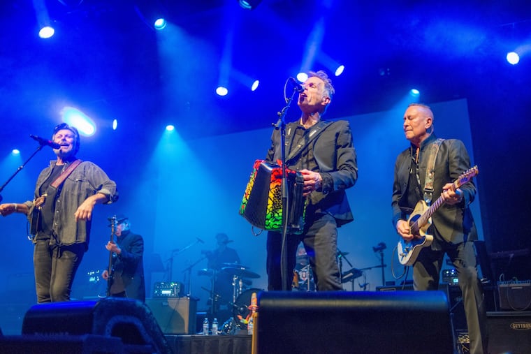 Eric Bazilian, Rob Hyman, and John Lilley of the Hooters perform during the "Pierre Robert: A Show of Life" concert on Dec. 17, 2025, at the Fillmore in Philadelphia.