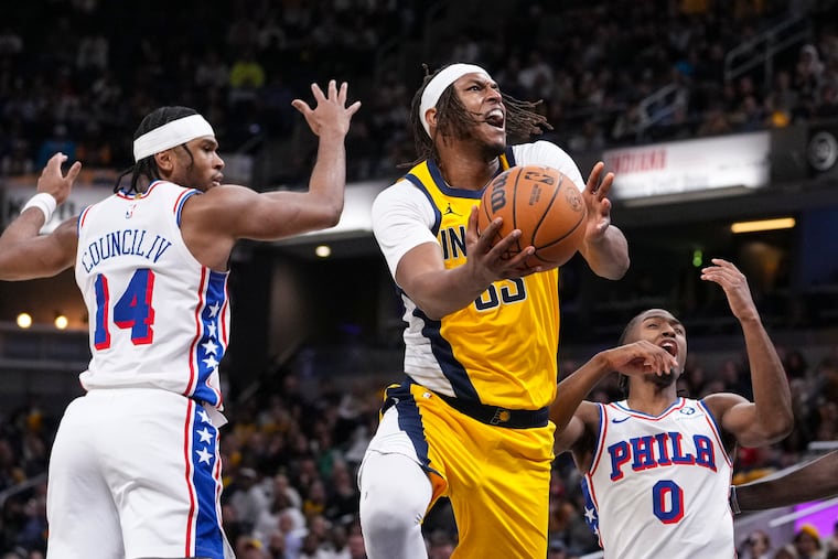 Indiana Pacers center Myles Turner (33) shoots over Sixers guard Tyrese Maxey (0) and guard Ricky Council IV (14) during the second half of their game inside the Gainbridge Fieldhouse on Saturday.
