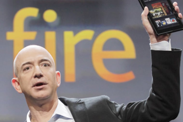 Jeff Bezos, Chairman and CEO of Amazon.com, introduces the Kindle Fire in New York on Wednesday. (Mark Lennihan / AP Photo)