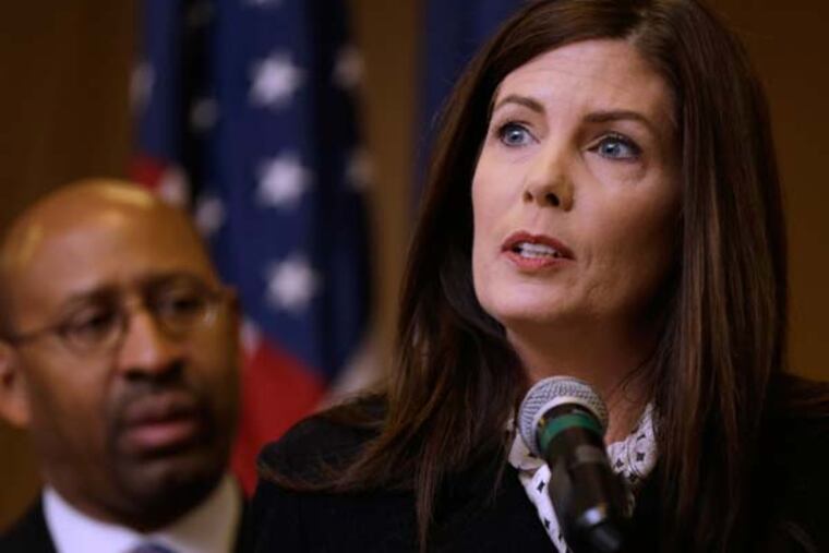 Pennsylvania Attorney Gen. Kathleen Kane, accompanied by Philadelphia Mayor Michael Nutter, speaks during a news conference Friday, Feb. 8, 2013, in Philadelphia, as she announces that Pennsylvania officials are closing a gun-law loophole that lets residents get permits online from Florida, sometimes when they can't get them at home. (AP Photo/Matt Rourke)