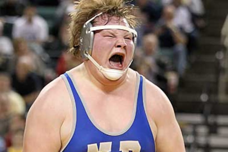 Northern Burlington's Cody Melton celebrates after winning his match at the NJSIAA wrestling finals. (Charles Fox/Staff Photographer)